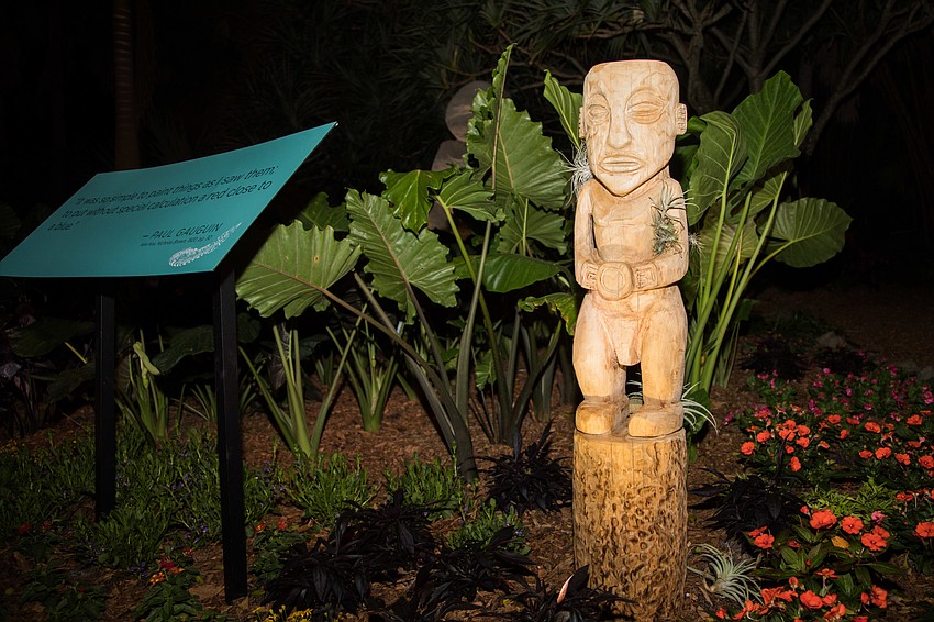 The Gauguin: Voyage to Paradise exhibition features tapa cloth, masks, tikis, bamboo and canoes.