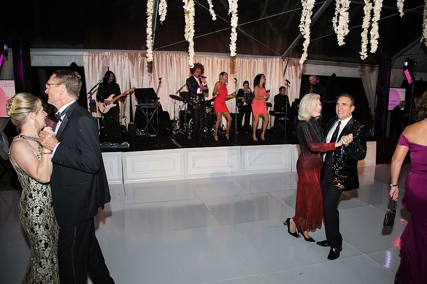 After guests were ushered under the tent, a few braved the dance floor before dinner.