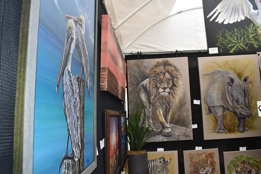 Janet Fisher's gallery displayed her paintings of animals in nature.