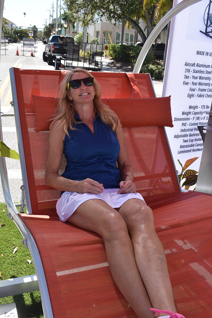 Eileen Blackburn tests out a chair at the festival.
