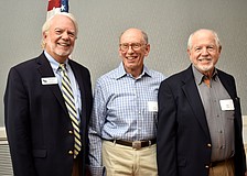 Longboat Key Democratic Club President Ken Marsh, guest speaker Gary Massel and Bob Gary