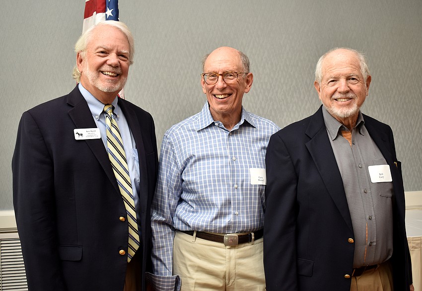 Longboat Key Democratic Club President Ken Marsh, guest speaker Gary Massel and Bob Gary