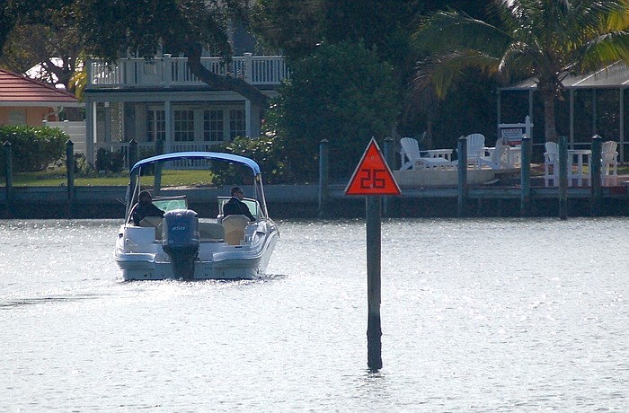 Markers both orange and green line the safe passage out of Buttonwood Harbor into Sarasota Bay.