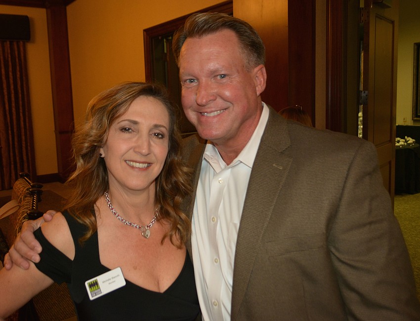 Sarasota's Michelle Bianchi visits with Jerry Lamb before the presentation began.