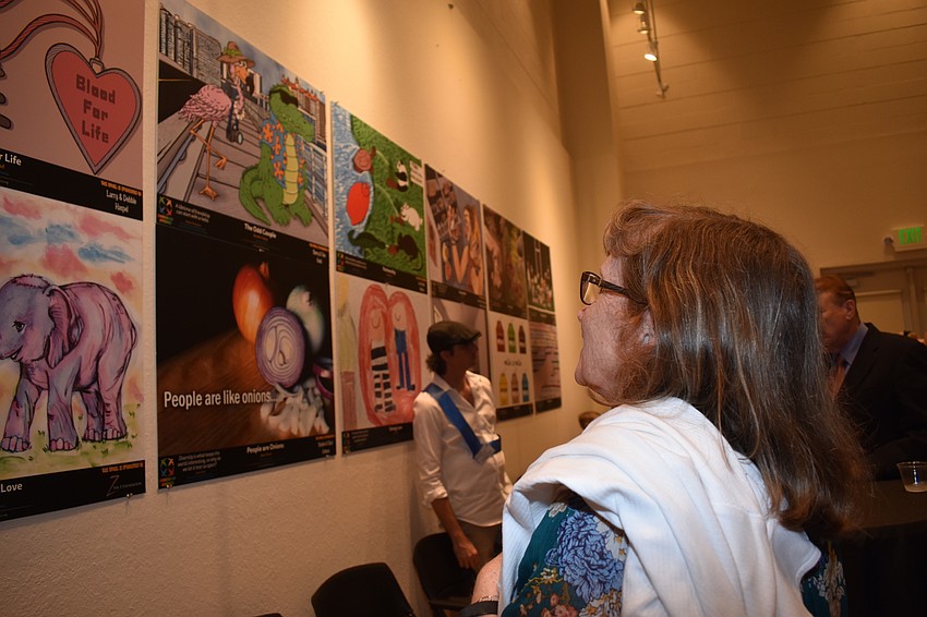 Diane Bensen takes a look at the art on the wall.