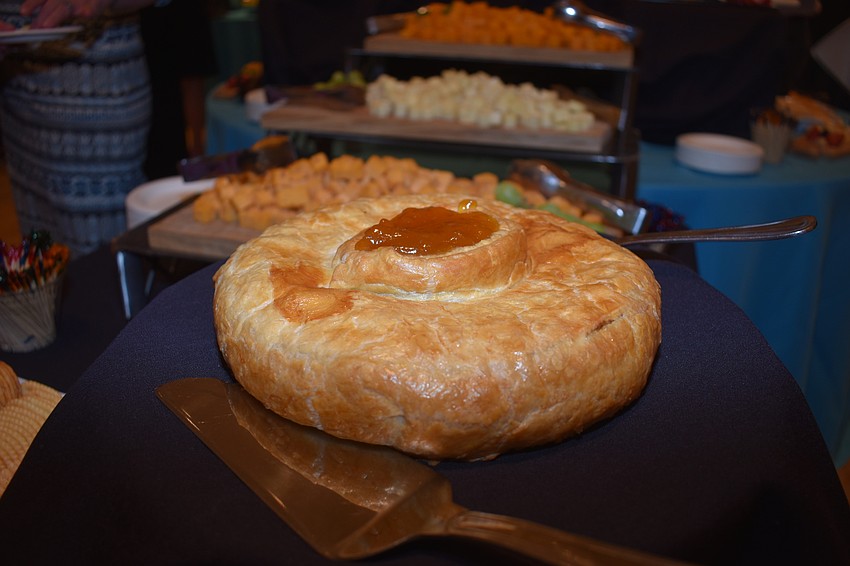 A cheese pastry from the French table was one of many different ethnic foods at the reception.