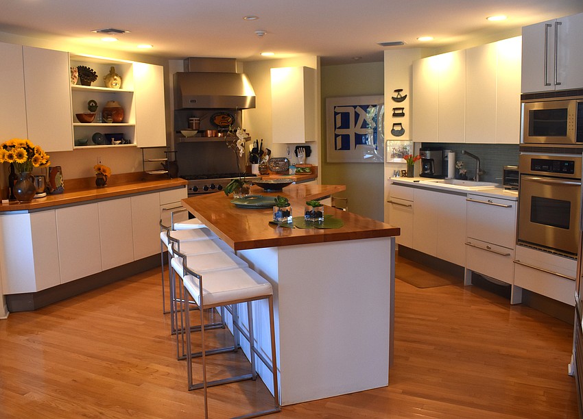 Off of the living room, is a spacious kitchen with an island for seating.