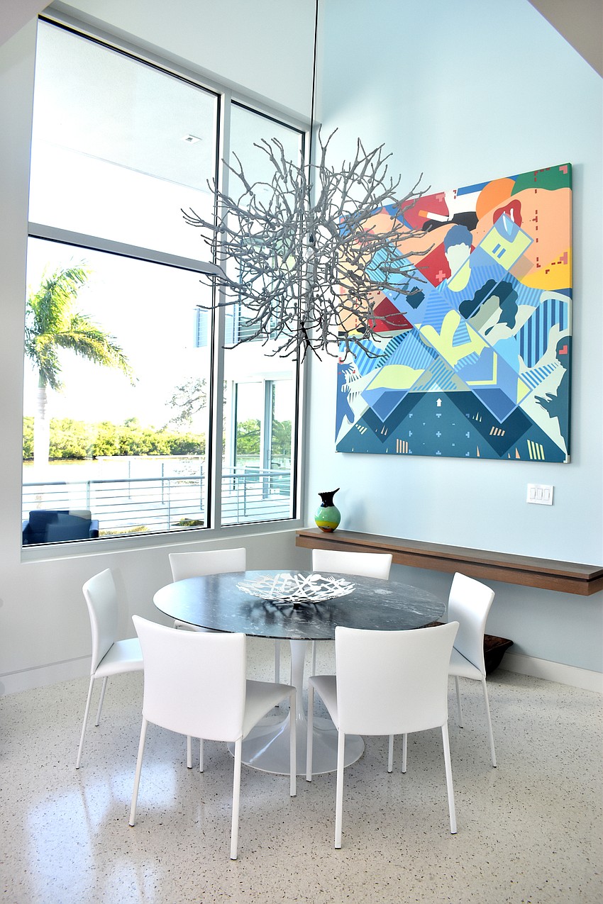 A kitchen-seating area overlooks Harris Bayou.