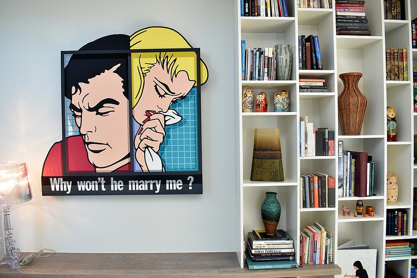 Artwork and bookshelves welcome visitors to the top floor.