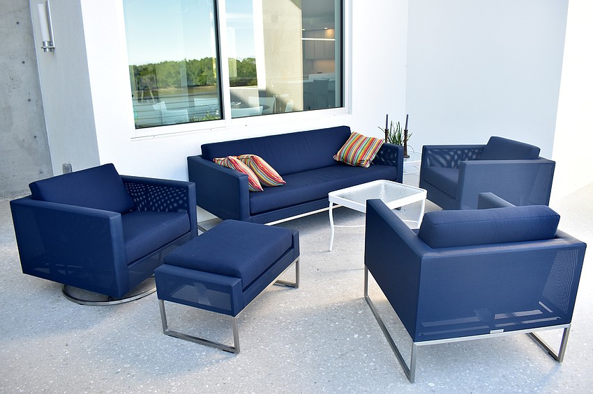 Outdoor seating offers views of Harris Bayou.