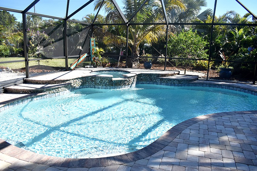 Virginia Luke’s home has an outdoor pool complete with a tiki bar.