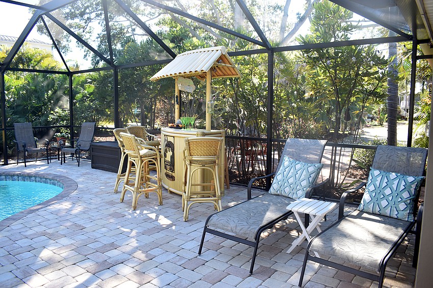 Virginia Luke’s home has an outdoor pool complete with a tiki bar.