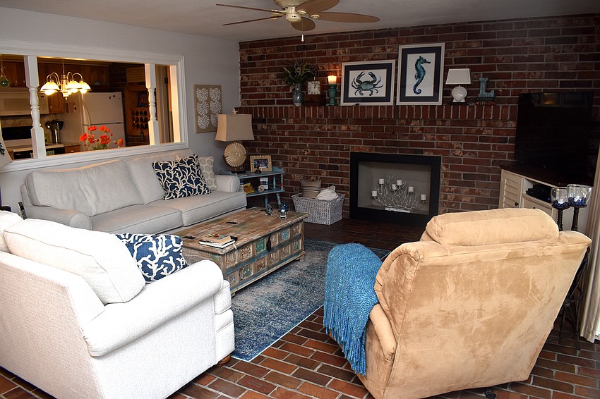 The living room offers various seating options for guests.