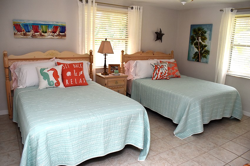 A guest bedroom gives off coastal vibes.