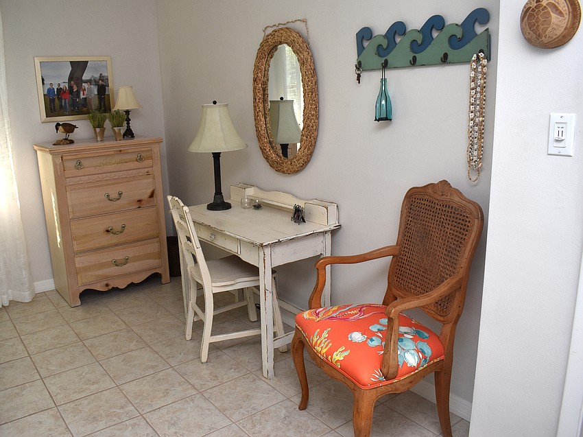 A guest bedroom gives off coastal vibes.