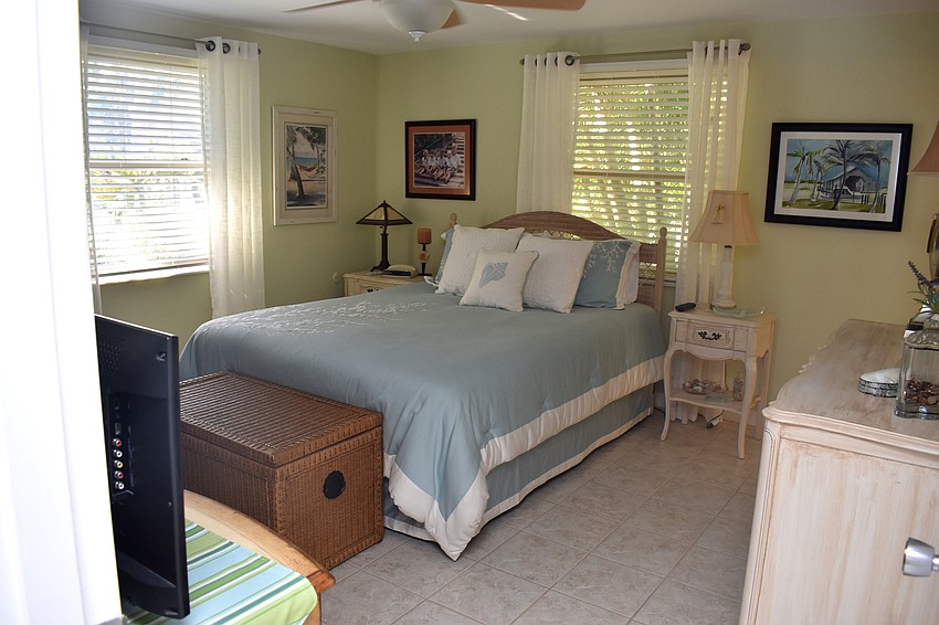 The master bedroom is painted a light green color with a calming effect.