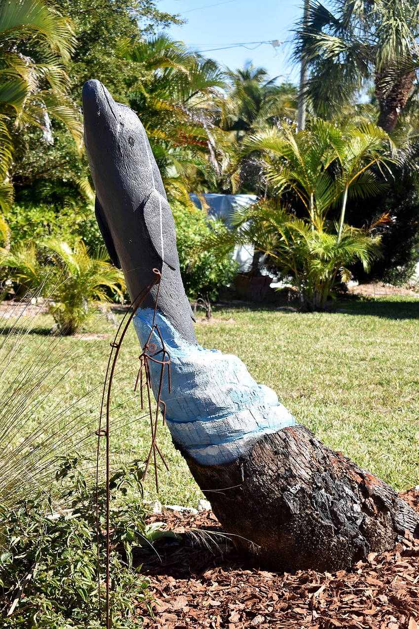 This dolphin was carved from a dead tree.