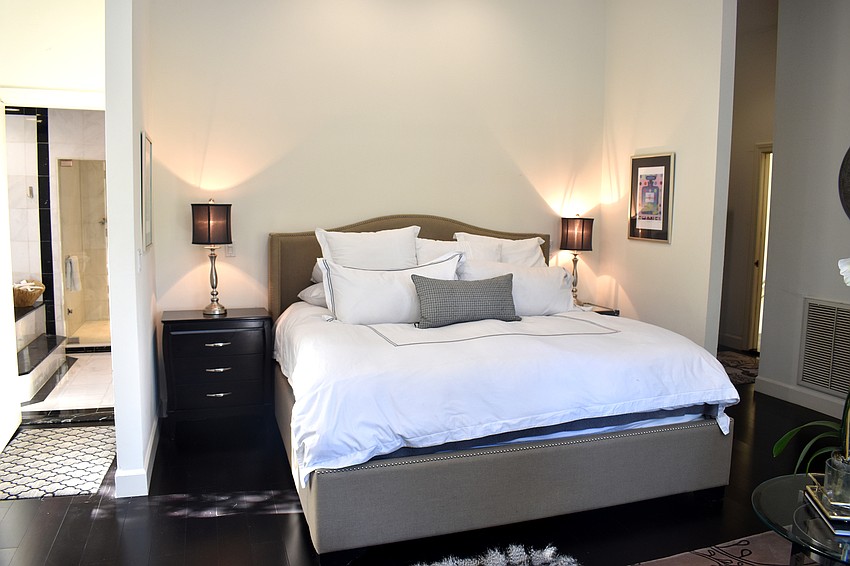 The master bedroom overlooks the pool deck.