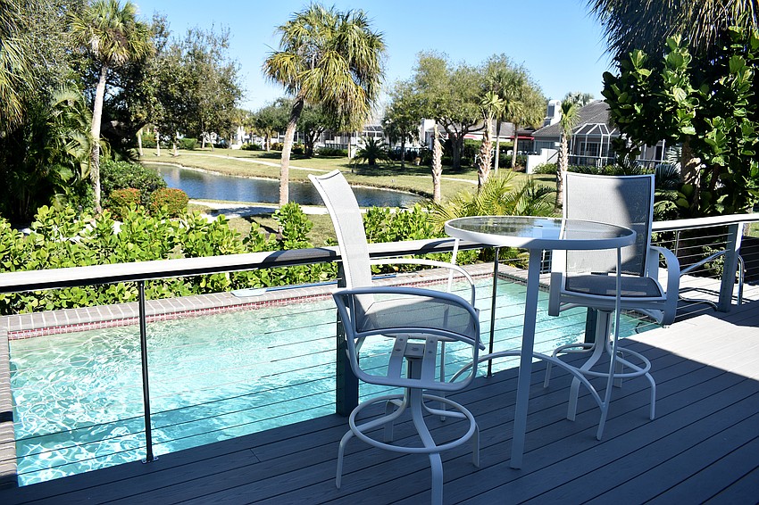 The pool overlooks the pond in Winding Oaks.