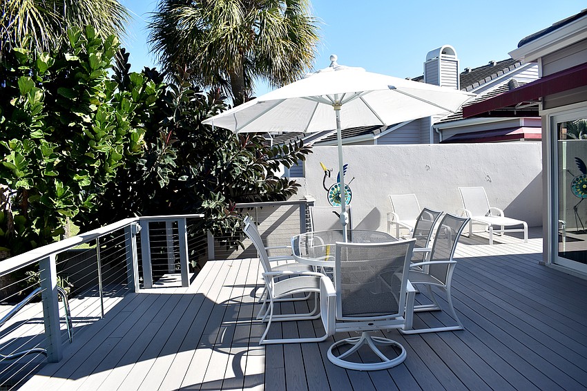 The outdoor patio makes an entertainment area with the extra seating.