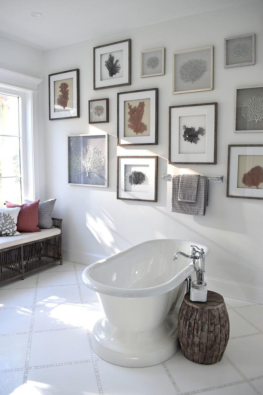 The master bathroom features a gallery wall.