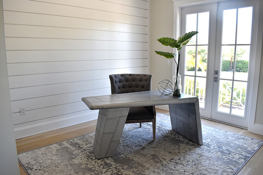 One of the bedrooms is modeled as an office.