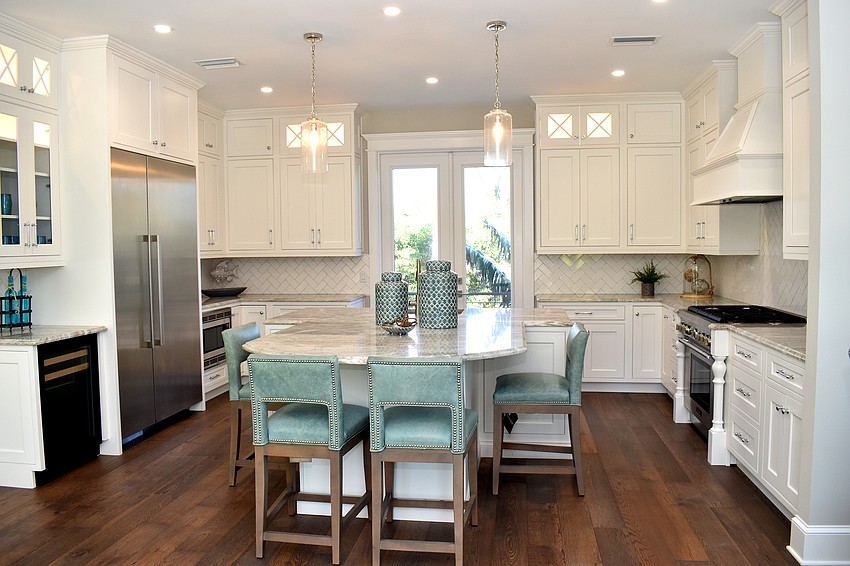 In the kitchen, a countertop island offers seating.