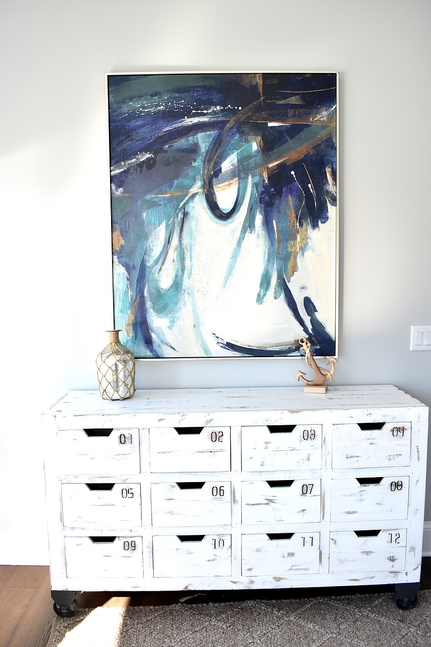 Coastal-themed decor accents the bedrooms.