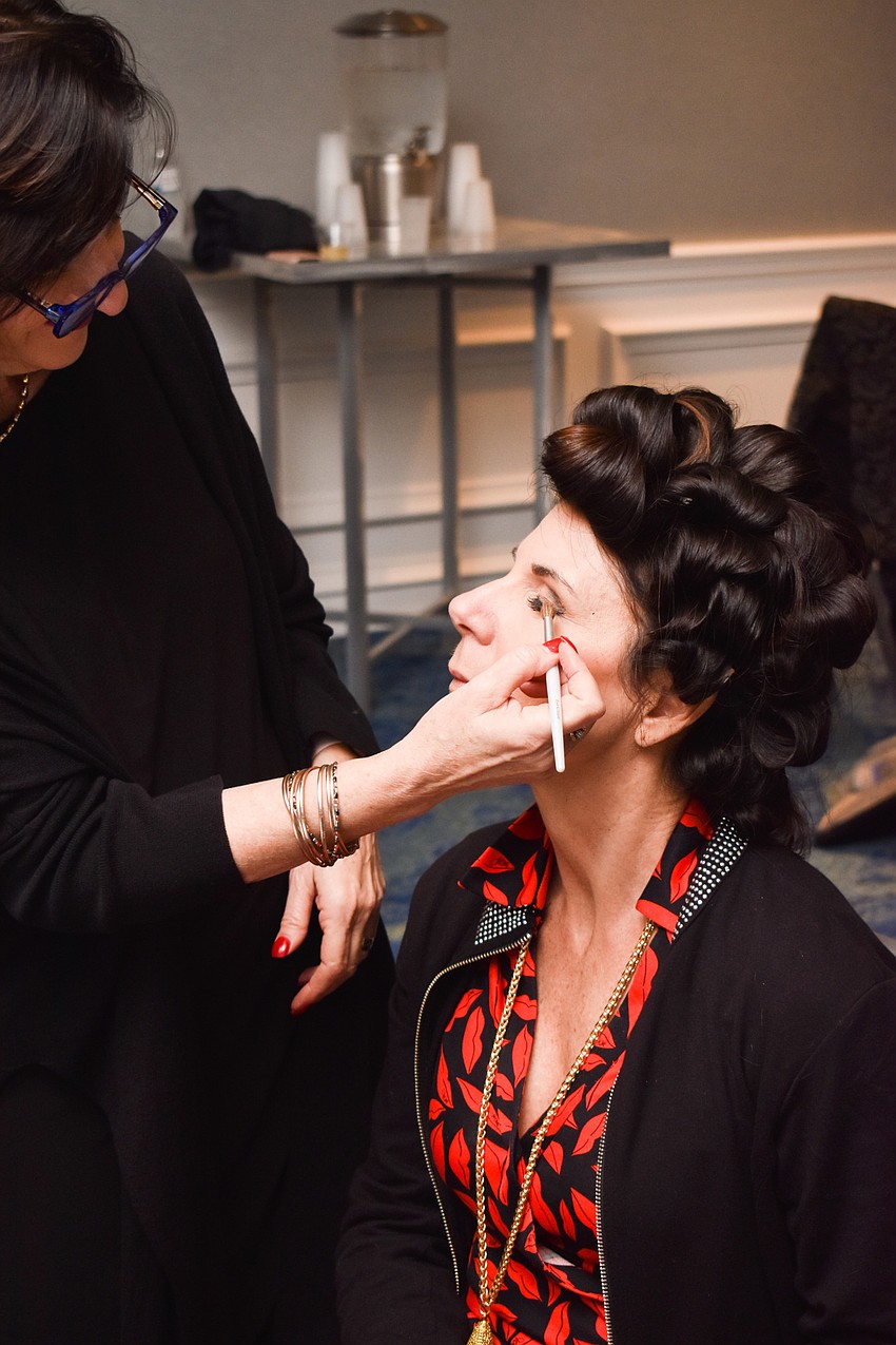 Mary Jo Pressman puts the final touches on Bambi Forristall's make up.