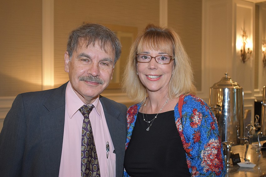 Hidayet Kutat of Gulf Coast Signs of Sarasota, Inc., and Roxanne Sima, CEO of Purmort & Martin Insurance Agency, LLC.