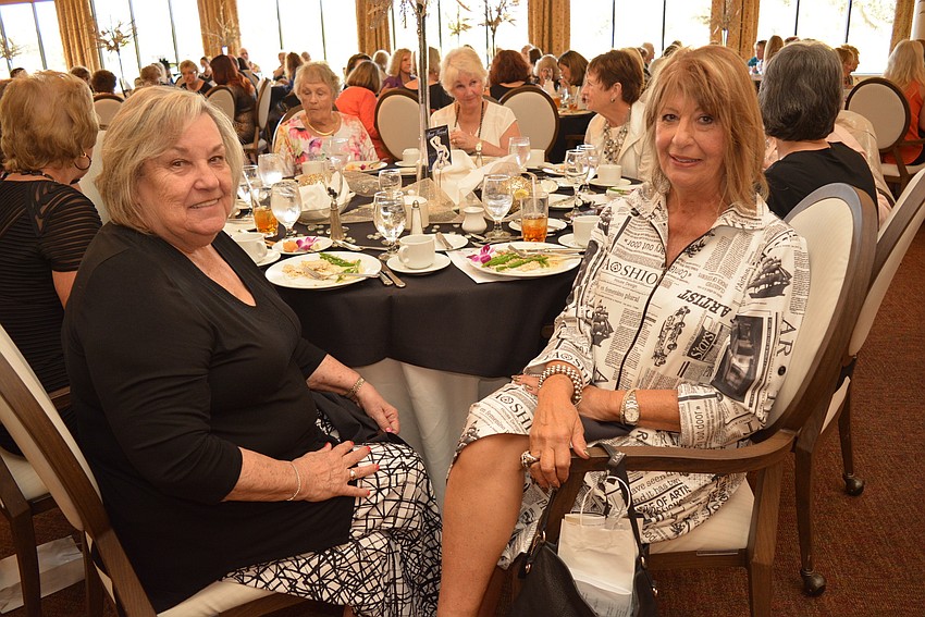 Marilyn Trescone, a 10-year Women's Club member, dines with friend Kathleen Allen, who is a model for the show.