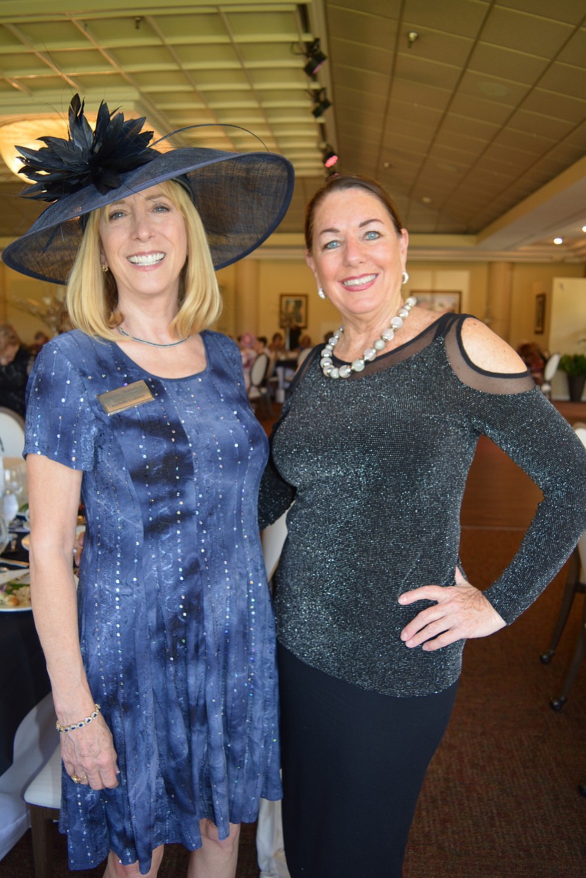 Palm Aire County Women's Club members Michelle Crabtree and Pattie Meades dress up for the ocassion.
