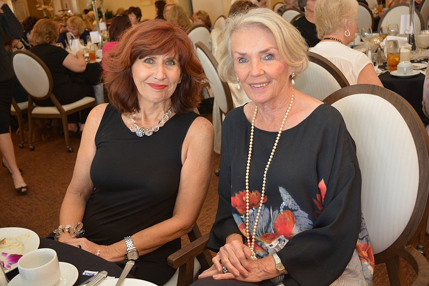 Mary Lou Geghan and Janet Jackson wait to hear if they won a raffle item.