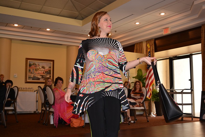 Arts and Cultural Alliance of Sarasota Communications Director Andrea Knies models for the show.