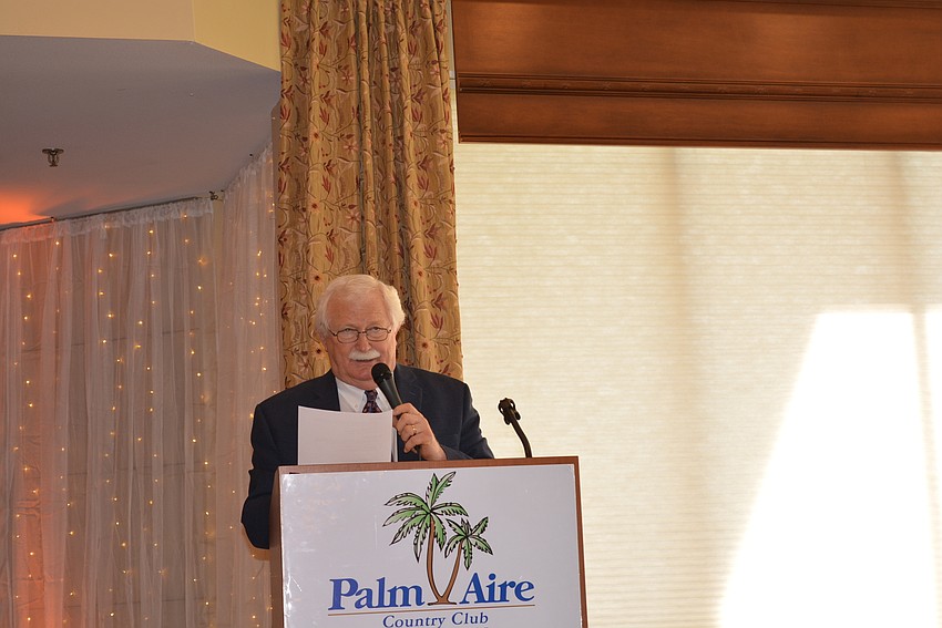 Jim Shirley, executive director of the Arts and Cultural Alliance of Sarasota County, applauds Palm Aire women for supporting charity while having fun.