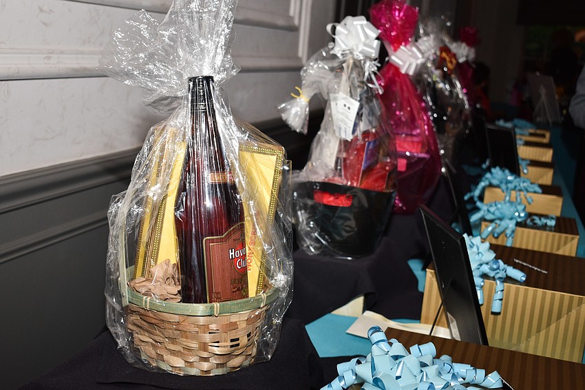 Chinese auction baskets lined the back wall of Michael's On East.