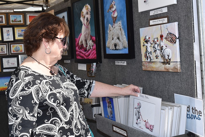 Debrorah Johsnon looks through the prints.