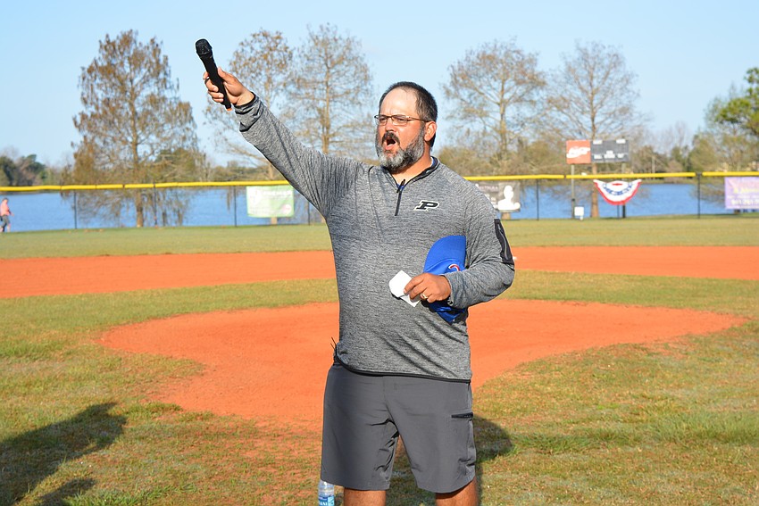 Cal Ripken league President Steve Marrero leads the crowd to open league play with a shout of 
