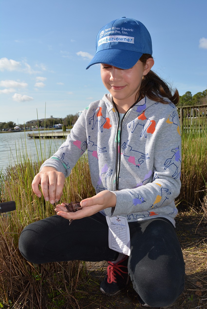 Central Park's Jadynn Bachman, 11, was more interested in playing with worms than fishing with them. 