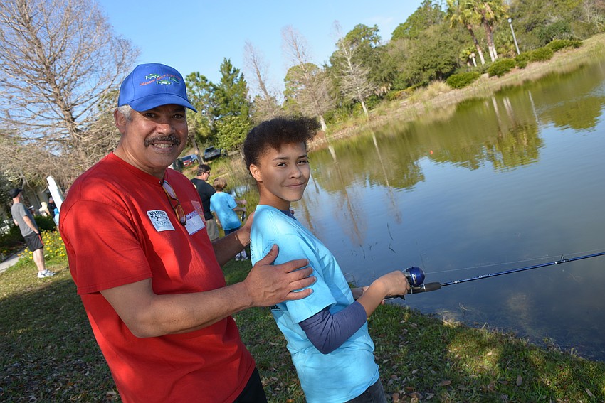Anglers Club member Miguel Caraballo coached his granddaughter, Haile Middle School student Shatazia Pecunia, 13,  The pair fish together about once a month.