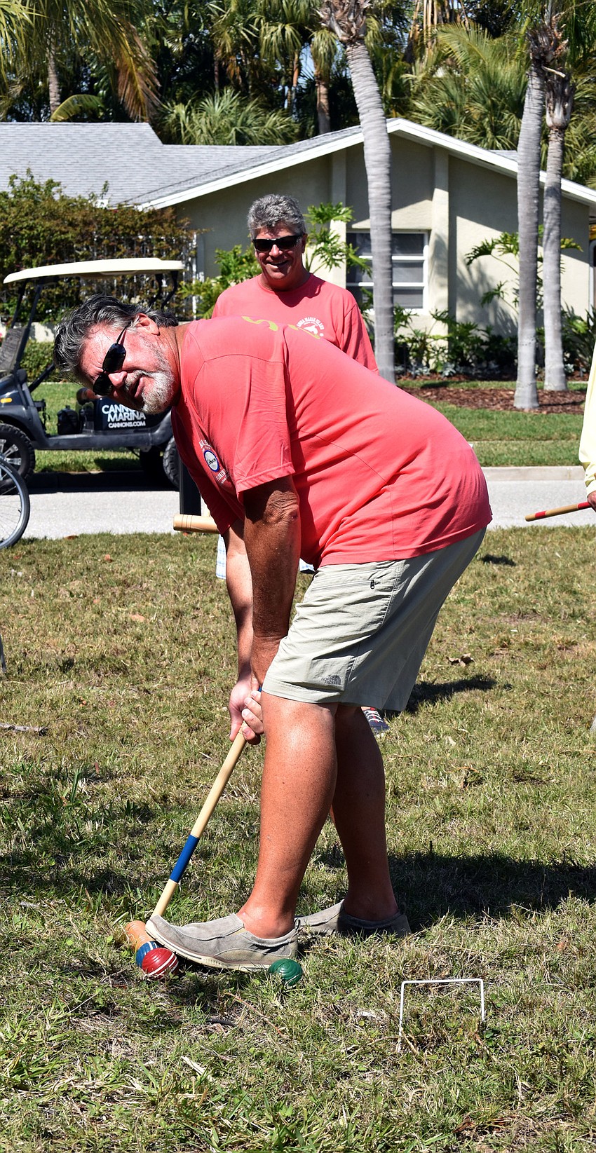 Southern DisComfort team member Jerry Donnelly launches another team's ball during a round of croquet.