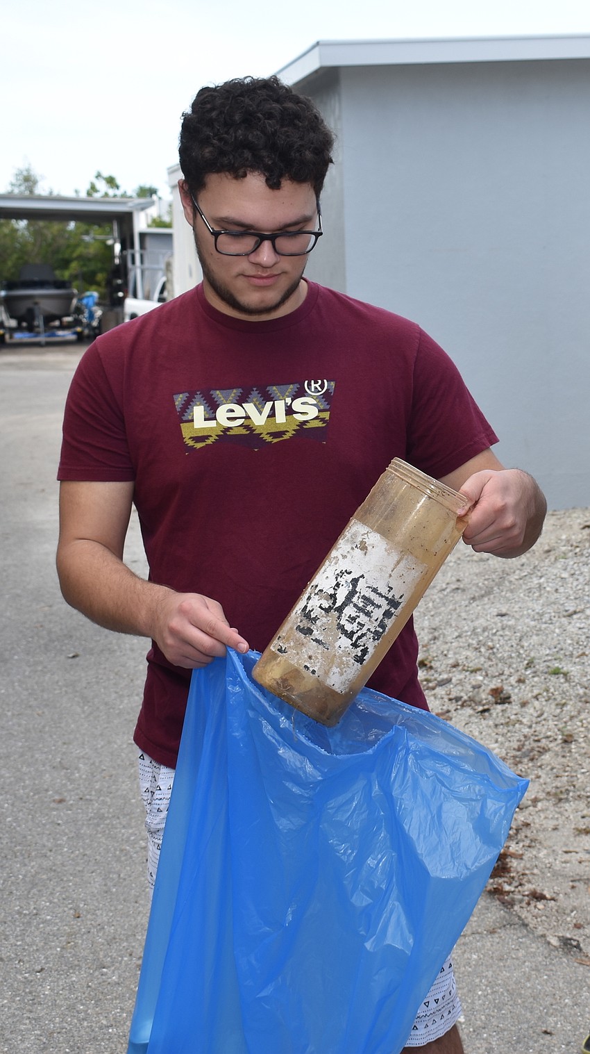 Gabriel Correa volunteered to come out early Saturday morning to pick up trash.