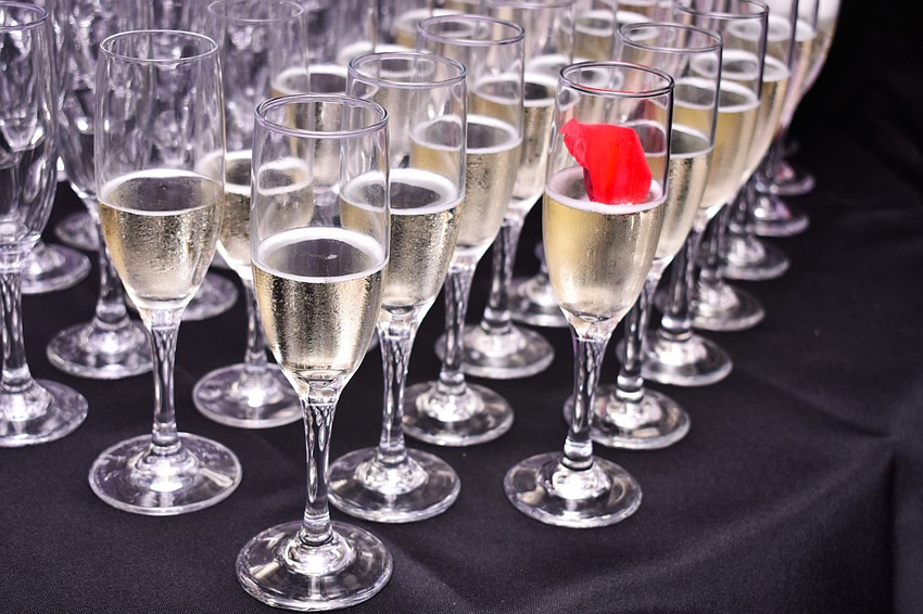 Guests grabbed a glass of champagne on their way in.