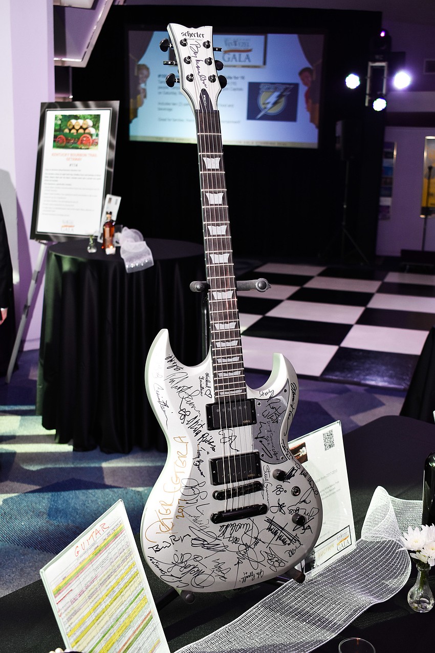 A guitar signed by the 2017-2018 Van Wezel performers was part of the auction.