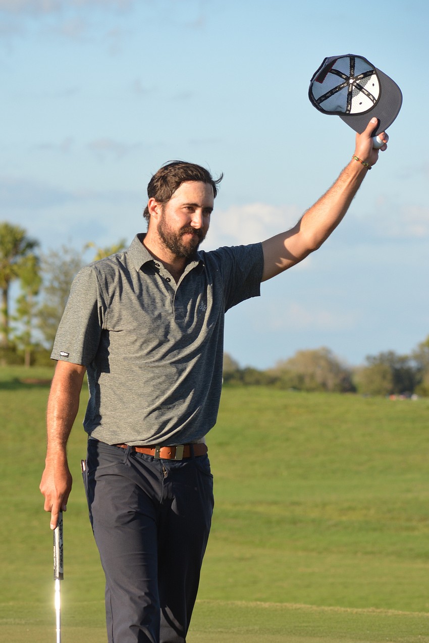 Mark Hubbard waves his hat to the crowd after winning the LECOM Suncoast Classic (26 under par).