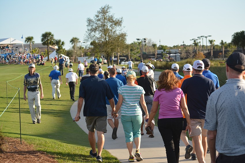 The crowd following eventual LECOM Suncoast Classic winner Mark Hubbard walks toward the 18th hole at Lakewood National.