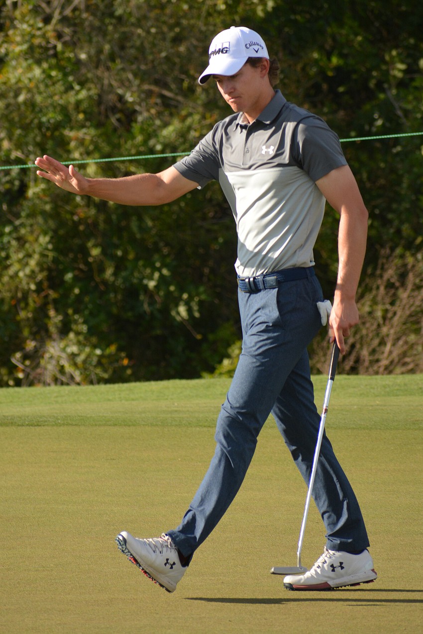 Maverick McNealy waves to the crowd after sinking a birdie on the 16th hole on the LECOM Suncoast Classic's final day, at Lakewood National. McNealy finished second (24 under par).