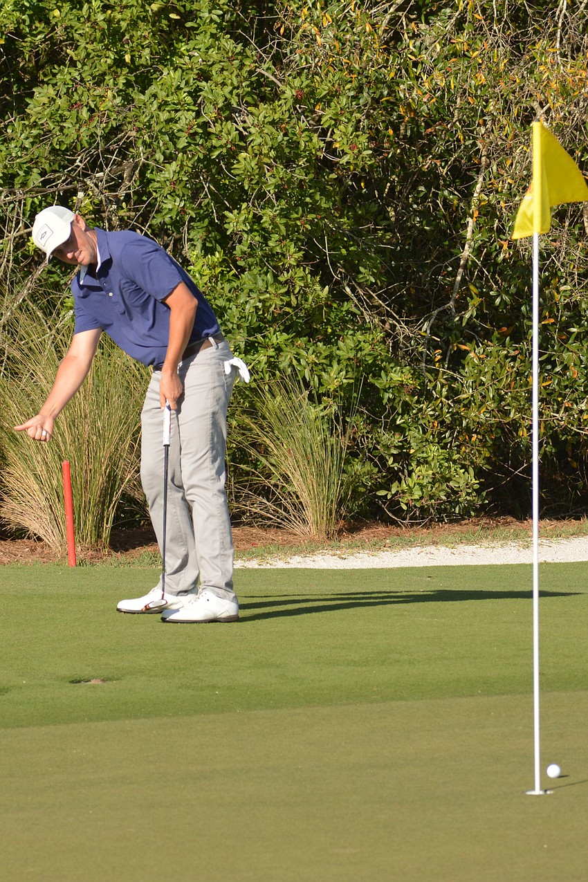 J.T. Griffin pleads for his putt to veer to his right on the 15th hole at Lakewood National. Griffin finished fifth at the LECOM Suncoast Classic (20 under par).
