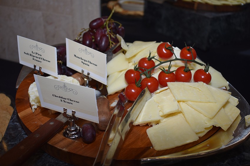 There were various snack foods available, like cheese, crackers and fruit.