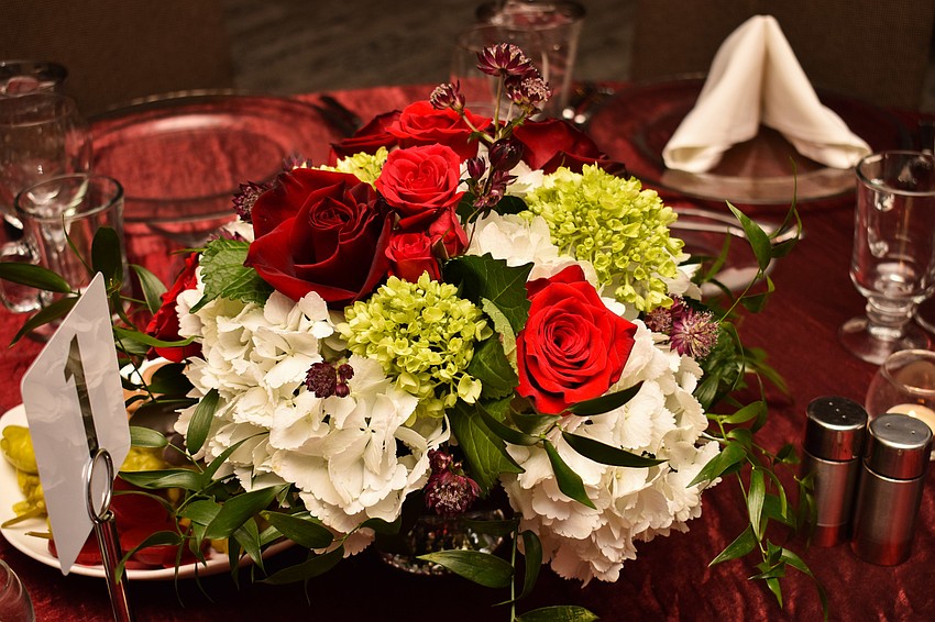 A bouquet of flowers centered the tables.
